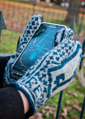 Hands in mittens holding a cellphone with the Ingress scanner displayed